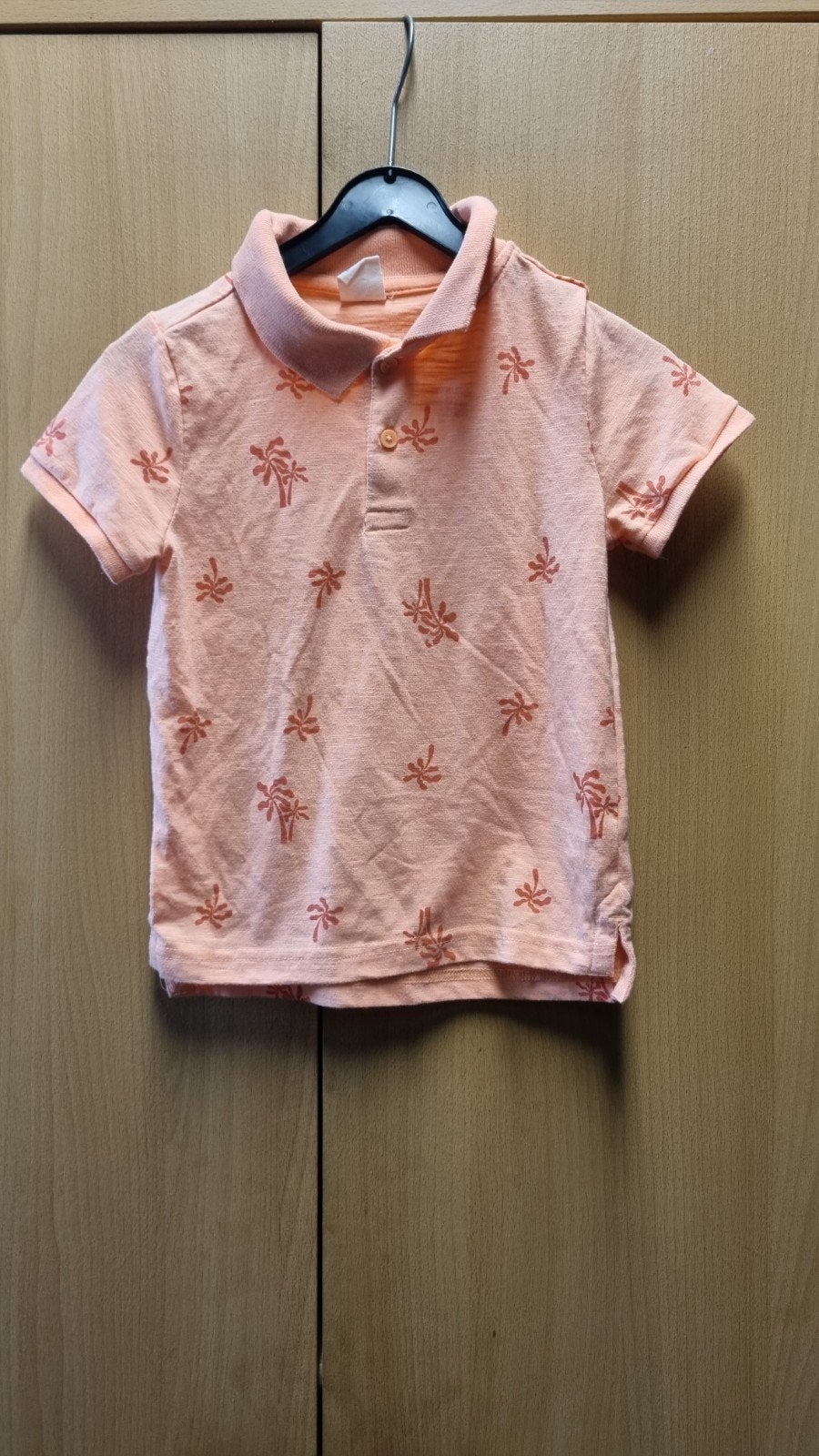 Leuke oranje polo met opdrukjes - Hema maat 110/116, Gebruikt, Jongen of Meisje, Ophalen of Verzenden, Shirt of Longsleeve