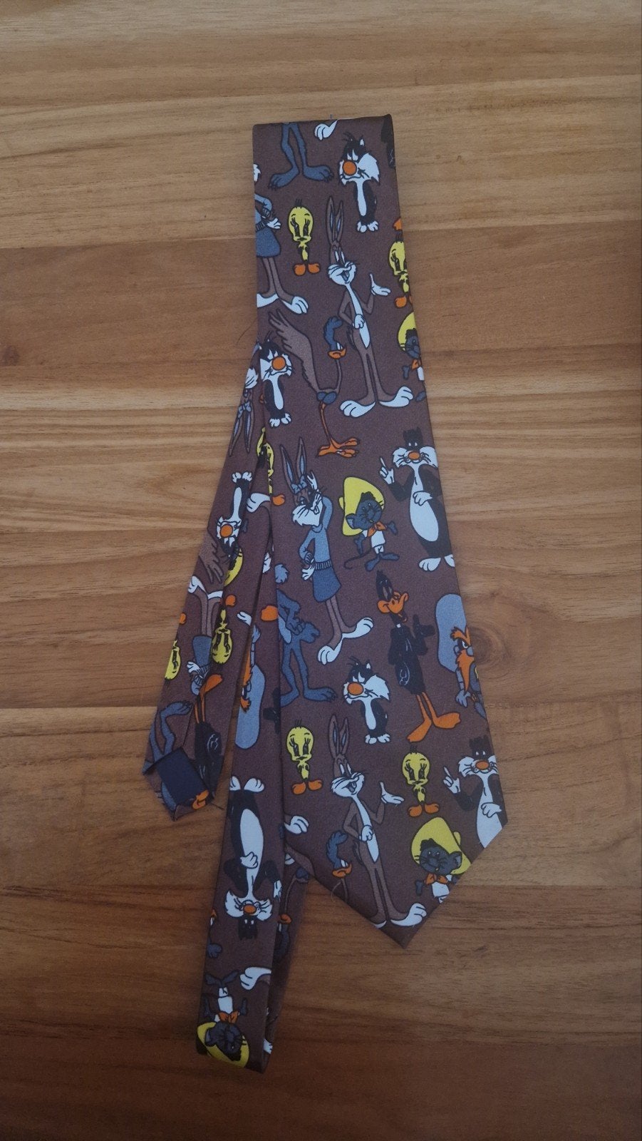 Zo goed als nieuwe stropdas met Looney Tunes figuren, Bruin, Ophalen of Verzenden, Zo goed als nieuw, Met patroon