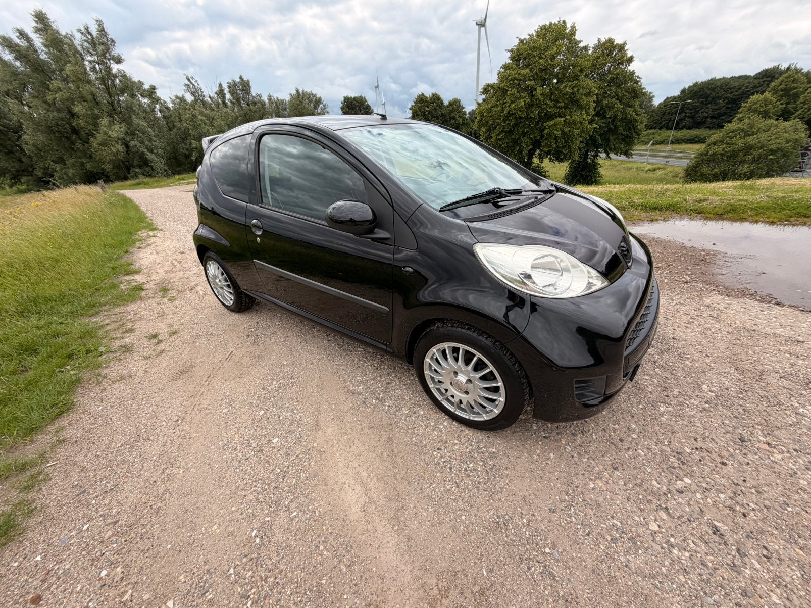Peugeot 107 1.0 12V 3DR 2010 81148km, Voorwielaandrijving, Stof, Zwart, 4 stoelen