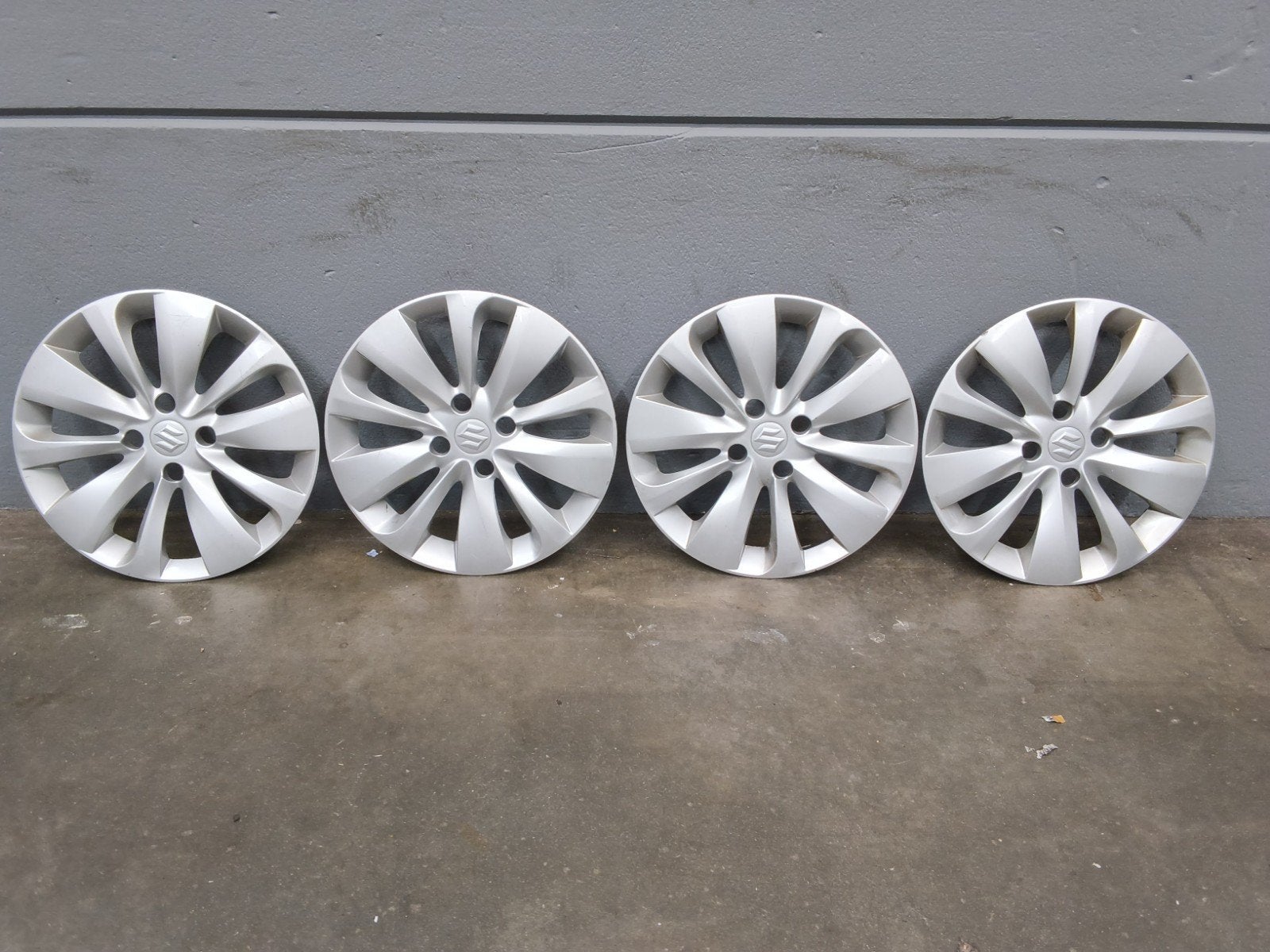 Set van 4 wieldoppen voor Suzuki Baleno 15 Inch gebruikt, Ophalen of Verzenden, Gebruikt
