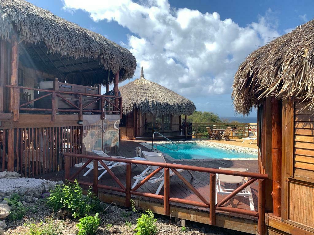 Romantische Palapa lodge Curacao aan zee met zwembad te huur, Vakantie, Vakantiehuizen | Nederlandse Antillen, Curaçao, Overige typen