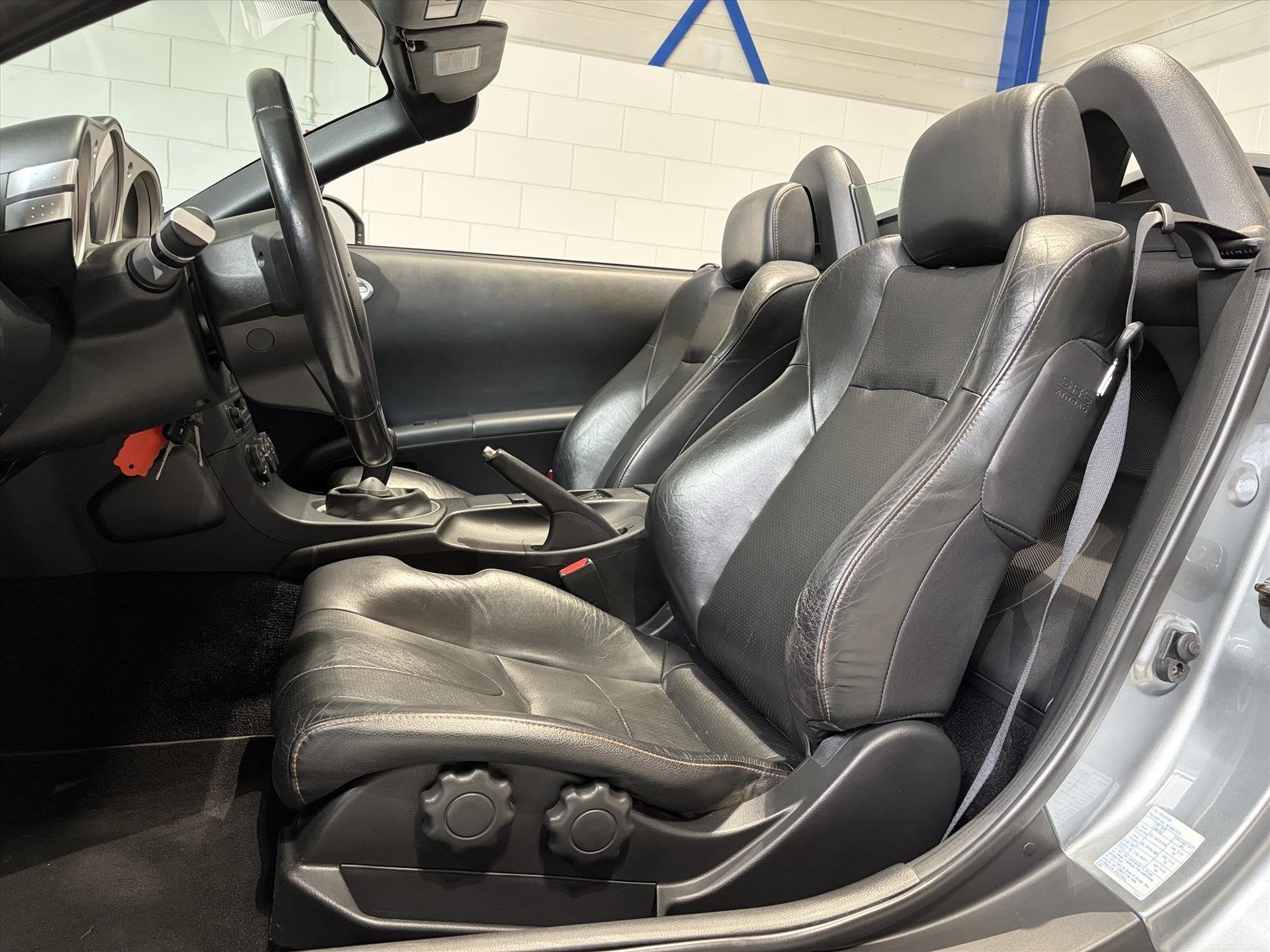 Nissan 350Z 3.5 V6 ROADSTER 280PK 73dkm NL AUTO!, Auto's, Dealer onderhouden, Zwart, Cabriolet, Bedrijf