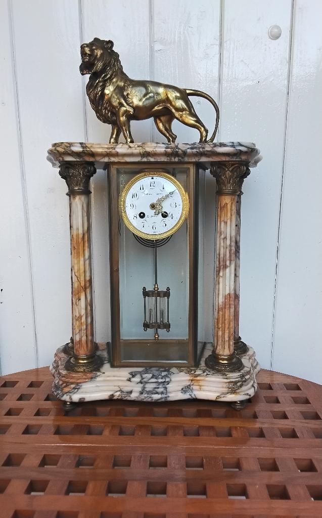 Grote antieke glaspendule, Ophalen
