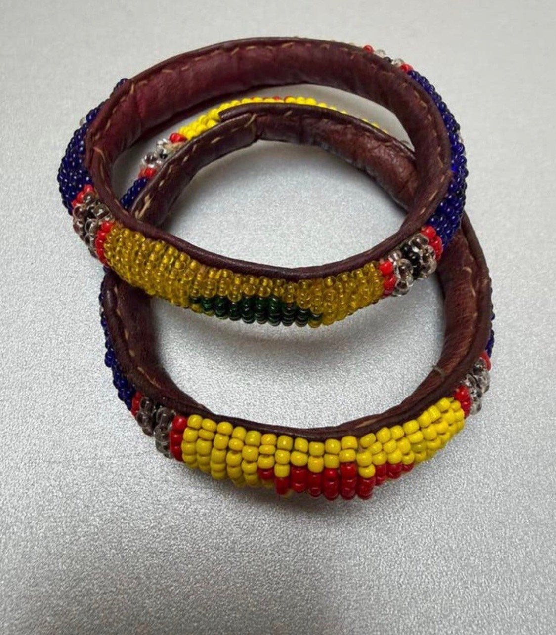 2 African beaded leather bangles, bracelets., Sieraden, Tassen en Uiterlijk, Ophalen of Verzenden, Zo goed als nieuw, Leer