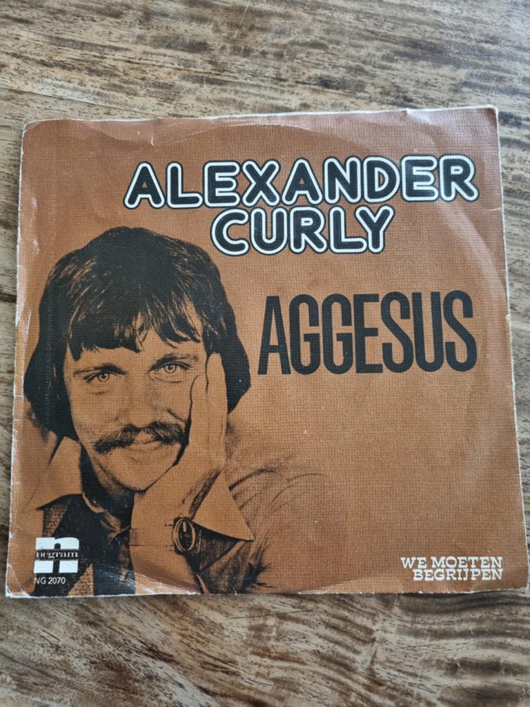 Alexander Curly - Aggesus / We Moeten Begrijpen (Single), Ophalen of Verzenden, Gebruikt, 7 inch, Levenslied of Smartlap