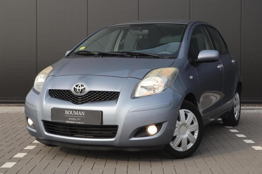 Toyota Yaris 1.3 VVTi Aspiration AUTOMAAT, CLIMATE DEALER OH, 4 cilinders, Blauw, 19 km/l, 550 kg