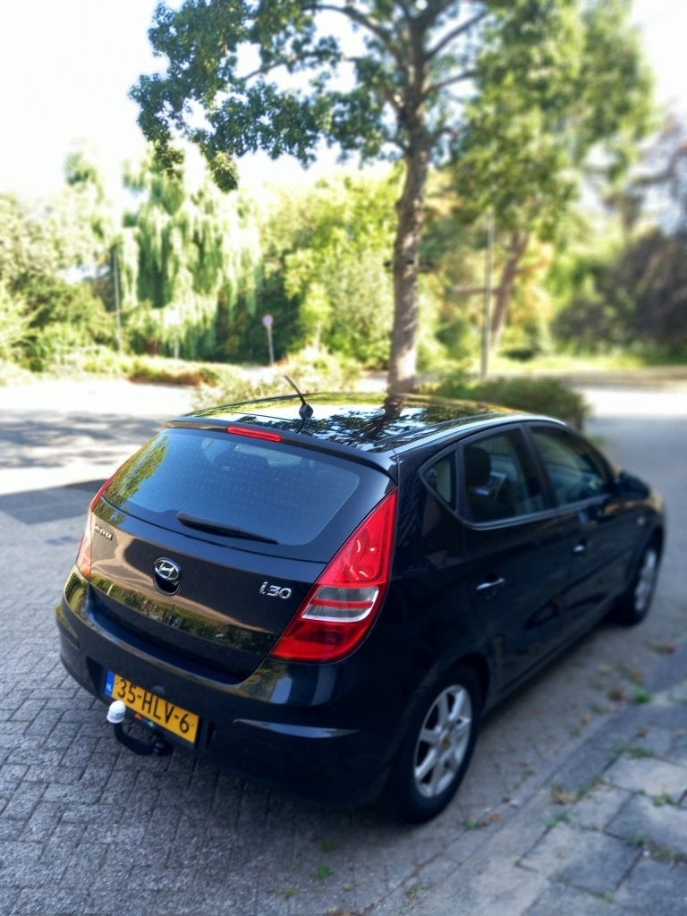 Hyundai i30 1.4i Cvvt 109pk Blue 2009 Zwart, Auto's, Voorwielaandrijving, Stof, Zwart, 4 cilinders