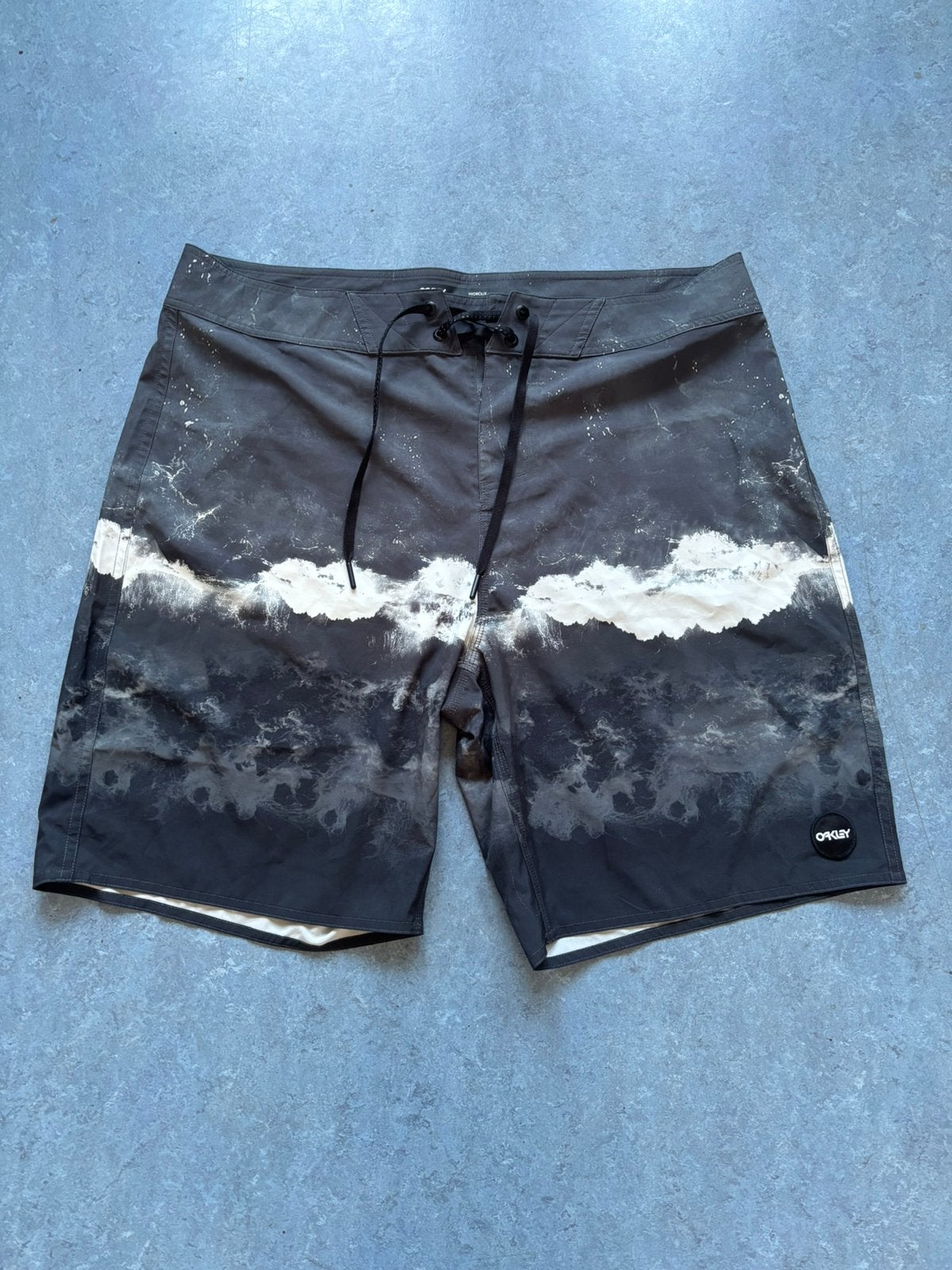 Oakley, Kleding | Heren, Ophalen of Verzenden, Zo goed als nieuw, Maat 52/54 (L), Grijs