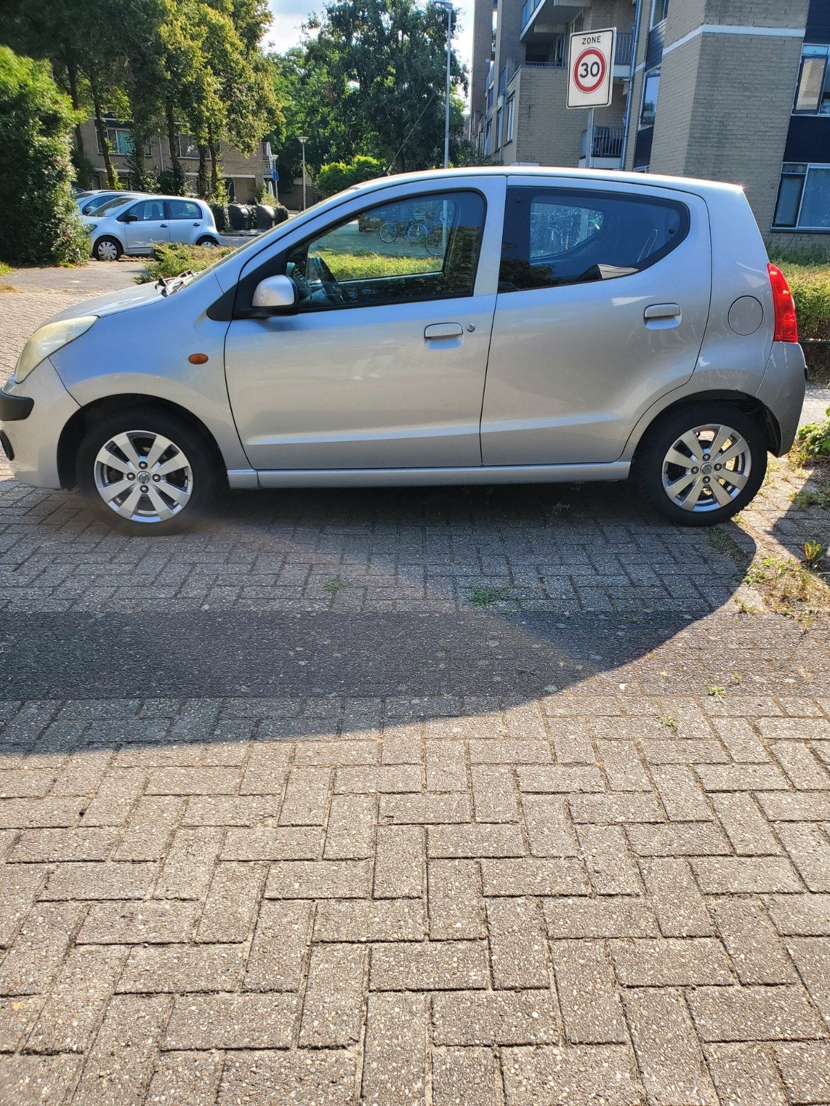 Nissan Pixo 1.0 50KW 5D 2012 Grijs, Auto's, Nissan, Voorwielaandrijving, 200 kg, 4 stoelen, Origineel Nederlands