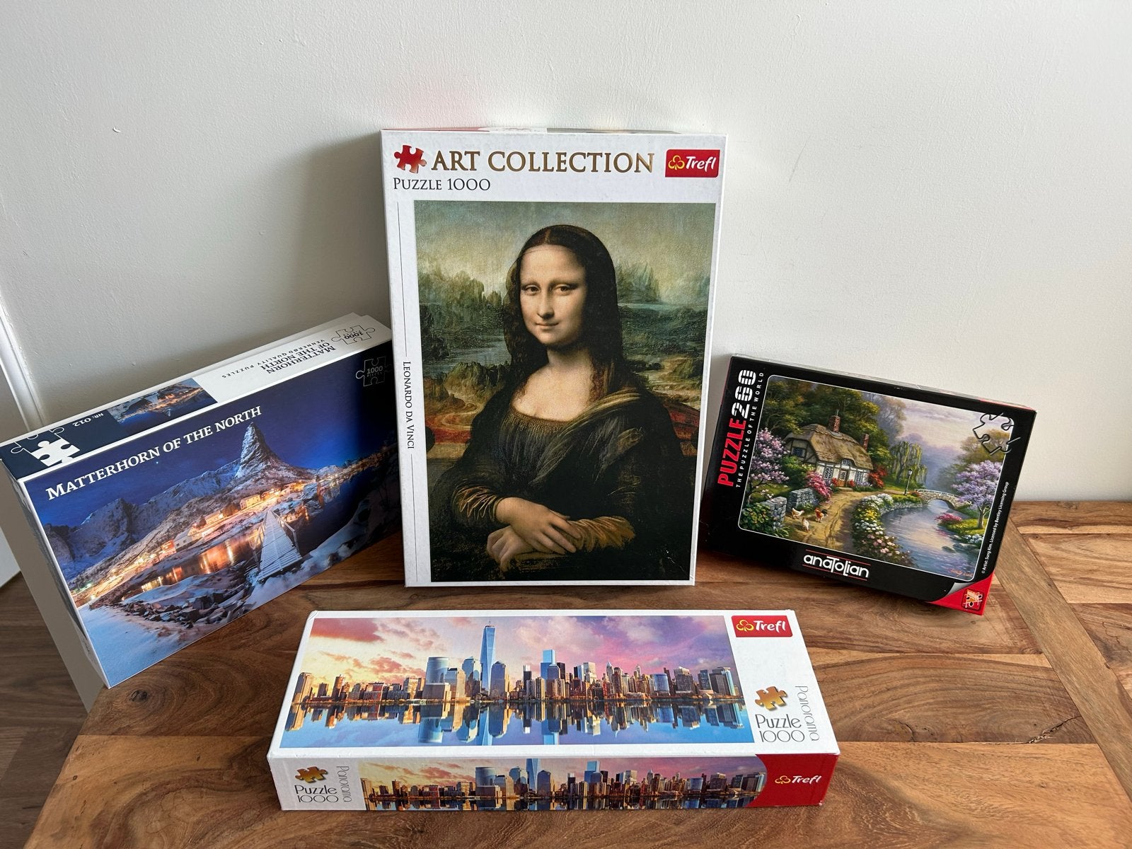 Diverse legpuzzels: Mona Lisa, Matterhorn, New York, Cottage, Ophalen of Verzenden, 500 t/m 1500 stukjes, Gebruikt, Legpuzzel