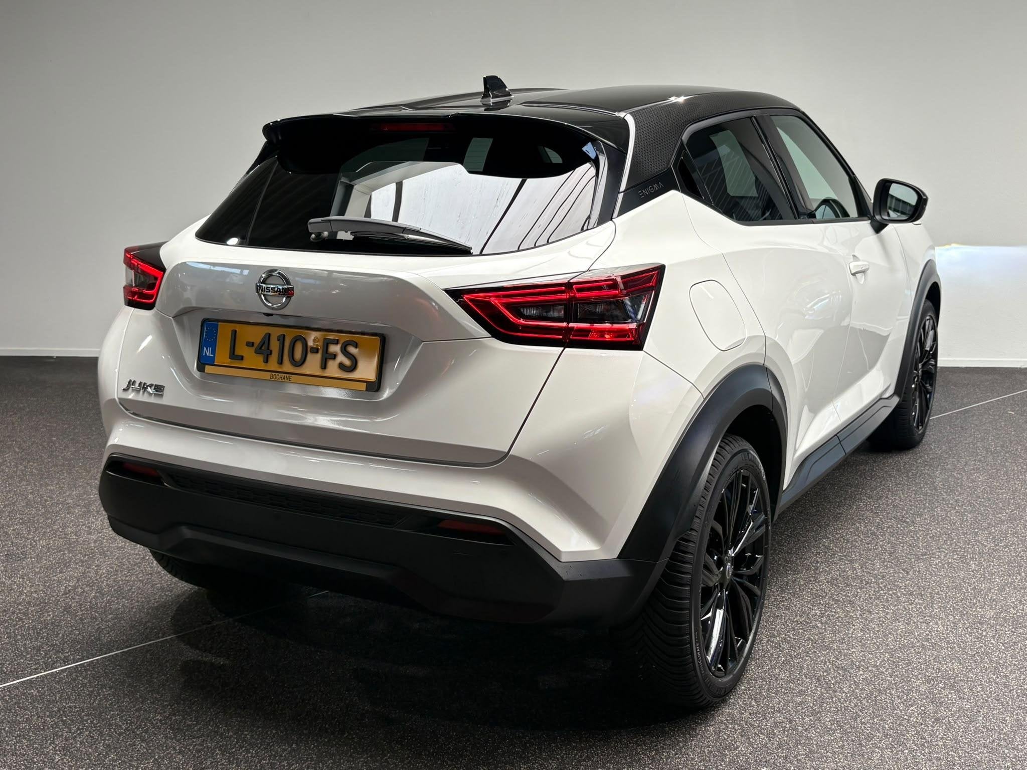 Nissan Juke 1.0 DIG-T Enigma | Navigatie | Camera | Stoelver, Auto's, Voorwielaandrijving, Stof, Met garantie (alle), Automatische klimaatregeling