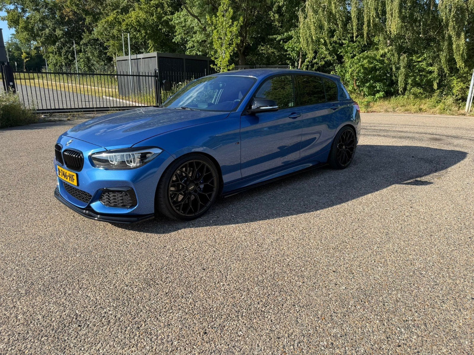 BMW 1-Serie M140i 340pk Aut 2017 Blauw, Auto's, BMW, Achterwielaandrijving, Blauw, 340 pk, 14 km/l