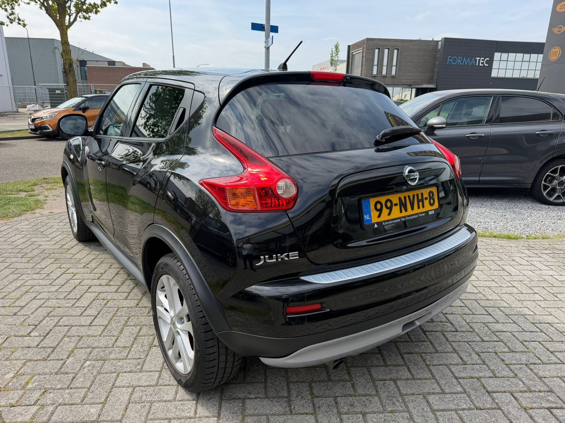 Nissan Juke 1.6 Tekna|Cam|T-haak|Leder, Auto's, Nissan, Euro 5, Zwart, 4 cilinders, Bedrijf