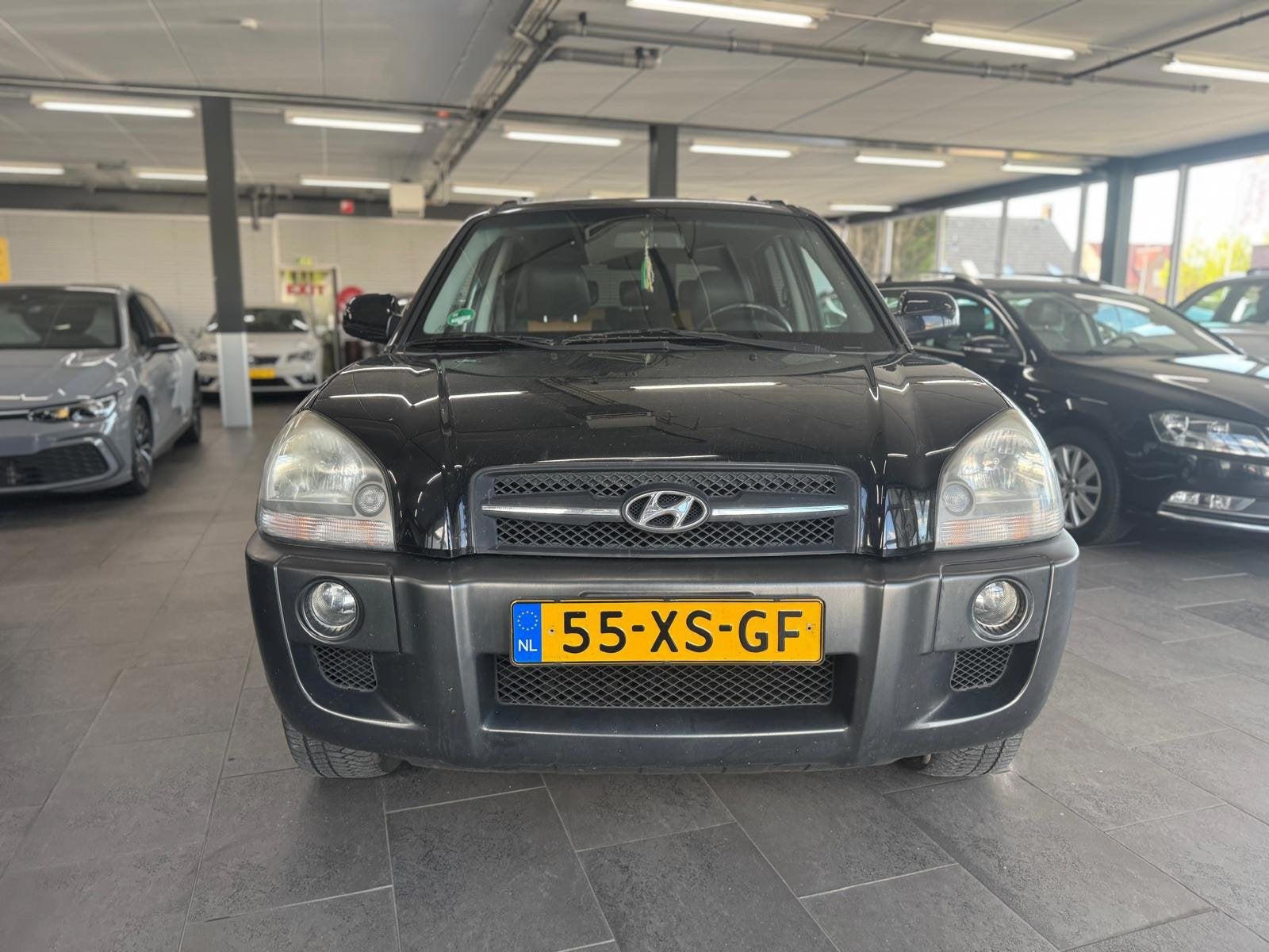 Hyundai Tucson 2.0i Style Premium LPG g3 leer clima cruise c, Auto's, Dealer onderhouden, 4 cilinders, Zwart, Handgeschakeld