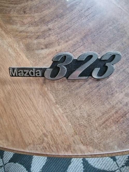 Mazda 323 Embleem - Origineel en Gebruikt, Ophalen of Verzenden