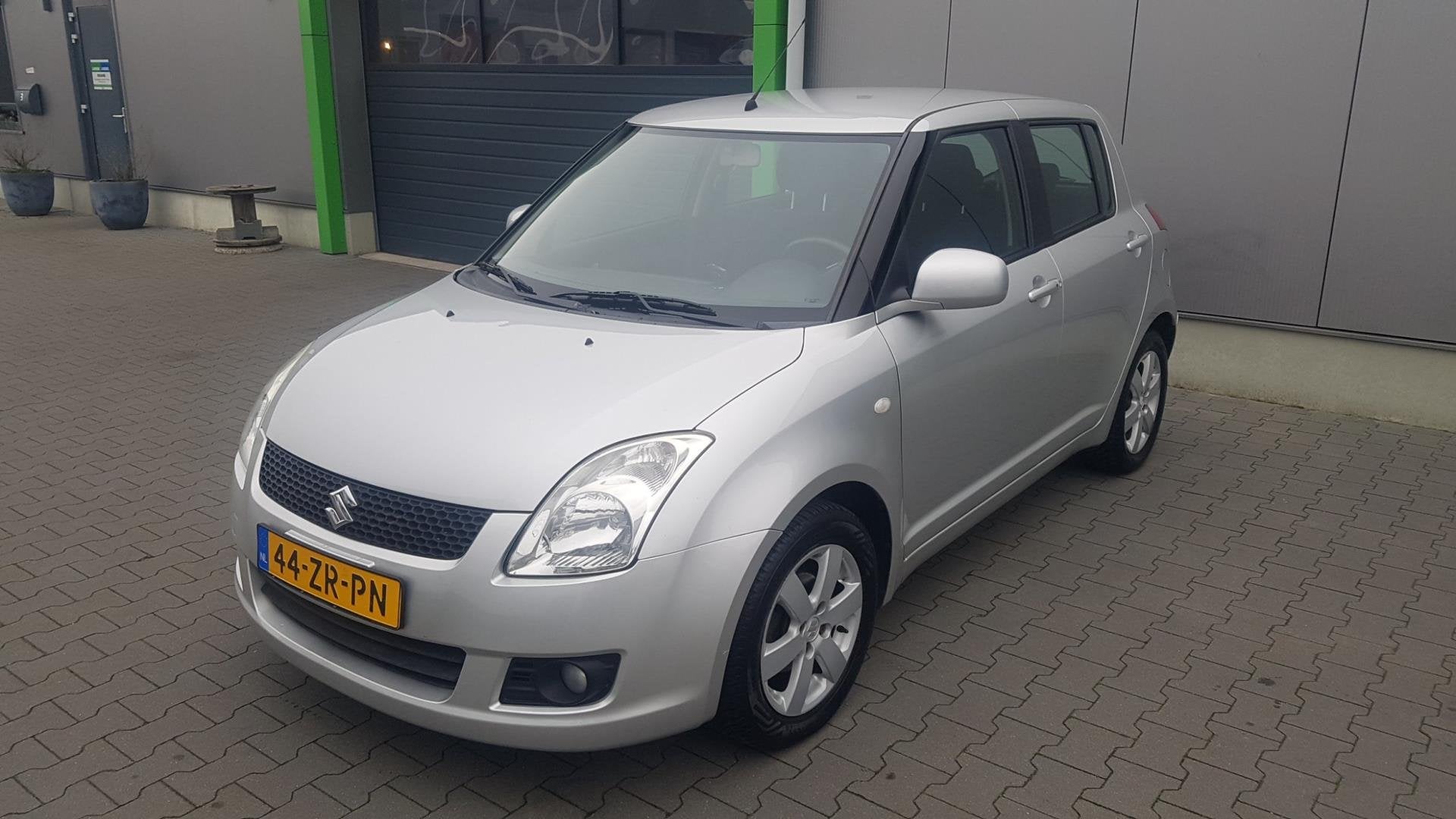 Suzuki Swift 1.3 Exclusive in zeer nette uitvoering All seas, Auto's, Stof, Zwart, 400 kg, Verwarmde buitenspiegels