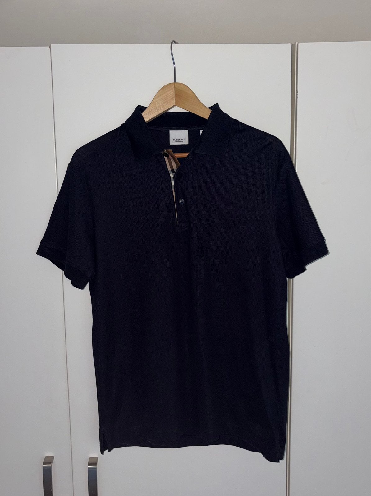Burberry zwarte polo met Burberry Check detail, Ophalen of Verzenden, Zo goed als nieuw, Maat 48/50 (M), Zwart