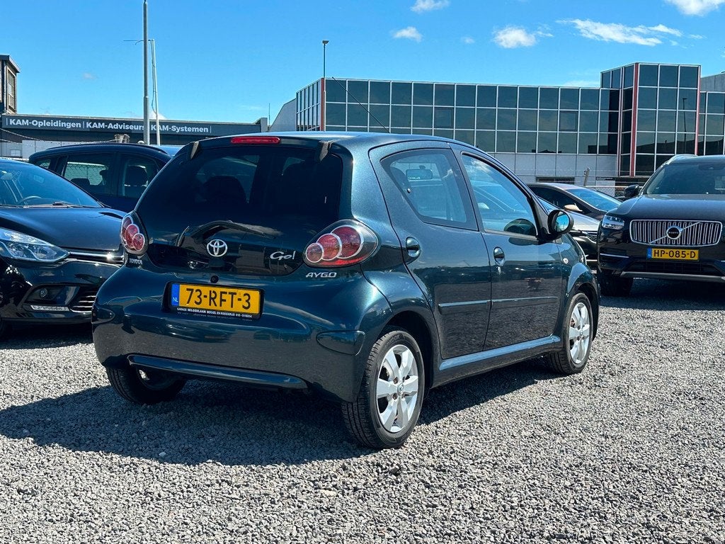 Toyota Aygo 1.0-12V Aspiration Green Navigator/AIRCO/AUTOMAA, Euro 5, Gebruikt, Zwart, 4 stoelen