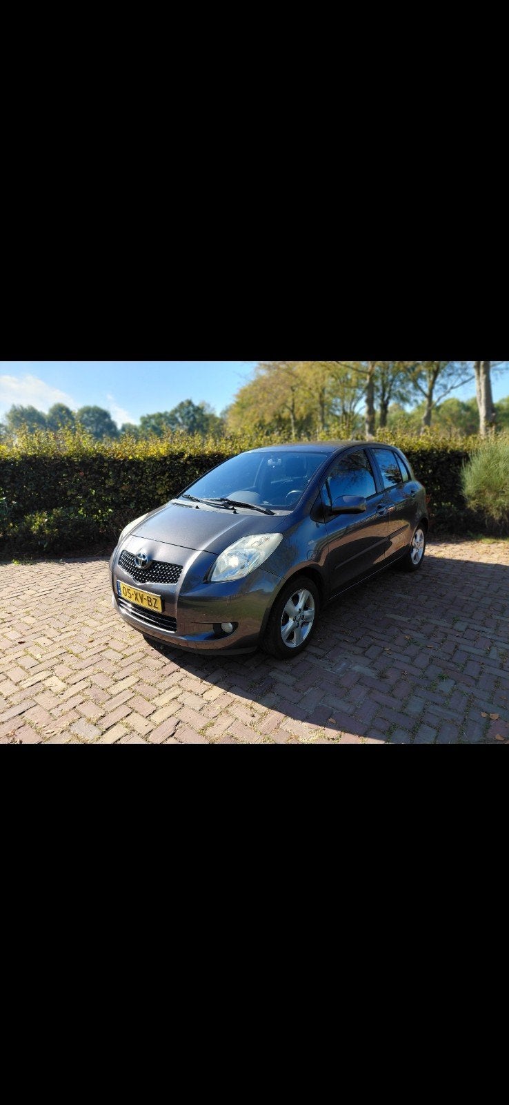 Toyota Yaris 1.3 16V Vvt-i 5DR 2007 Grijs, Auto's, Voorwielaandrijving, Stof, 40 €/maand, Zwart