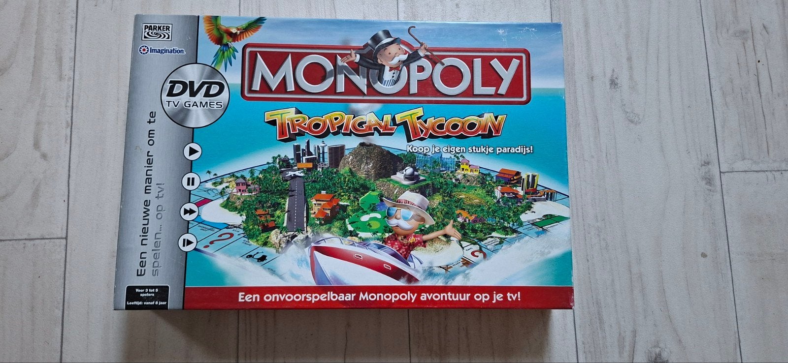 Monopoly Tropical Tycoon + DVD, Parker, Ophalen of Verzenden, Zo goed als nieuw, Een of twee spelers
