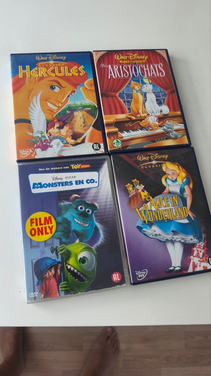 4 Disney DVD's: Monsters en Co, Aristocats, Hercules, Alice, Cd's en Dvd's, Ophalen of Verzenden