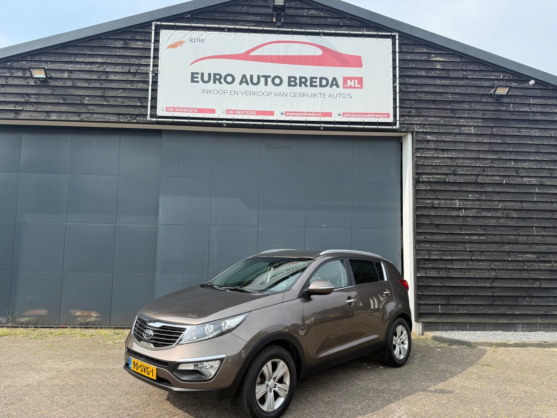 Kia Sportage 2.0 X-ecutive Plus Pack, Auto's, Kia, Gebruikt, Parkeersensor, 4 cilinders, Bruin