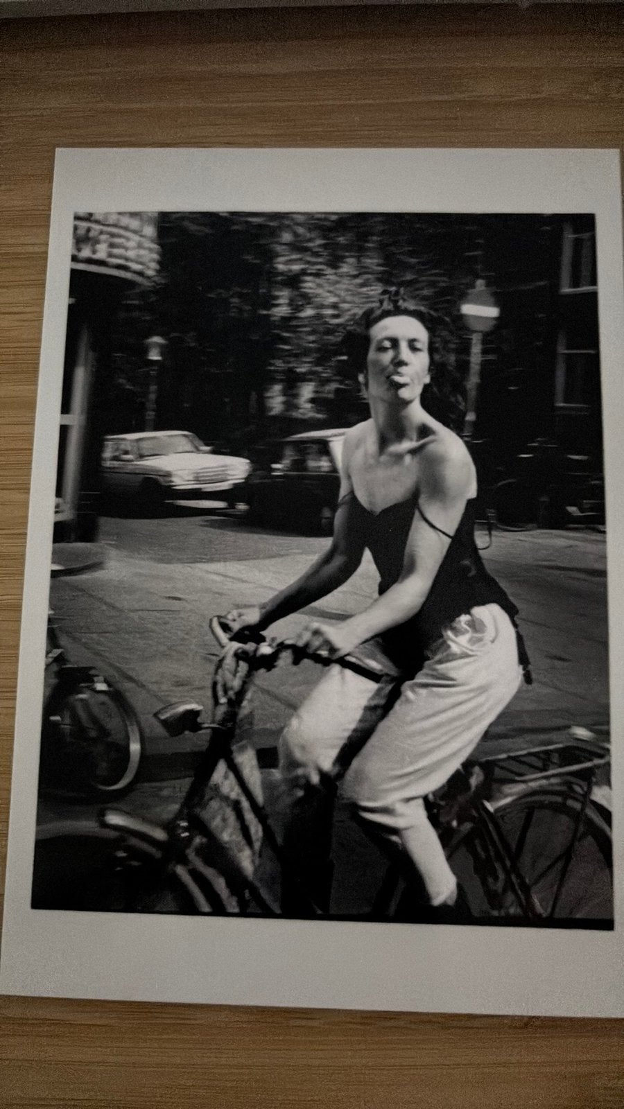 Ed van der Elsken WOMAN CYCLING AMSTERDAM 1983 Ansichtkaart, Ophalen of Verzenden, 1980 tot heden, Ongelopen, Sterren en Beroemdheden