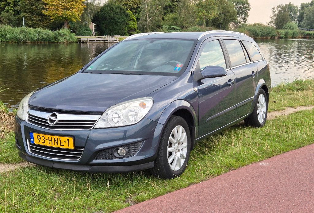 Opel Astra 1.6 16V 85KW St.wgn. 2009 Grijs, Auto's, Voorwielaandrijving, 657 kg, Stof, 4 cilinders