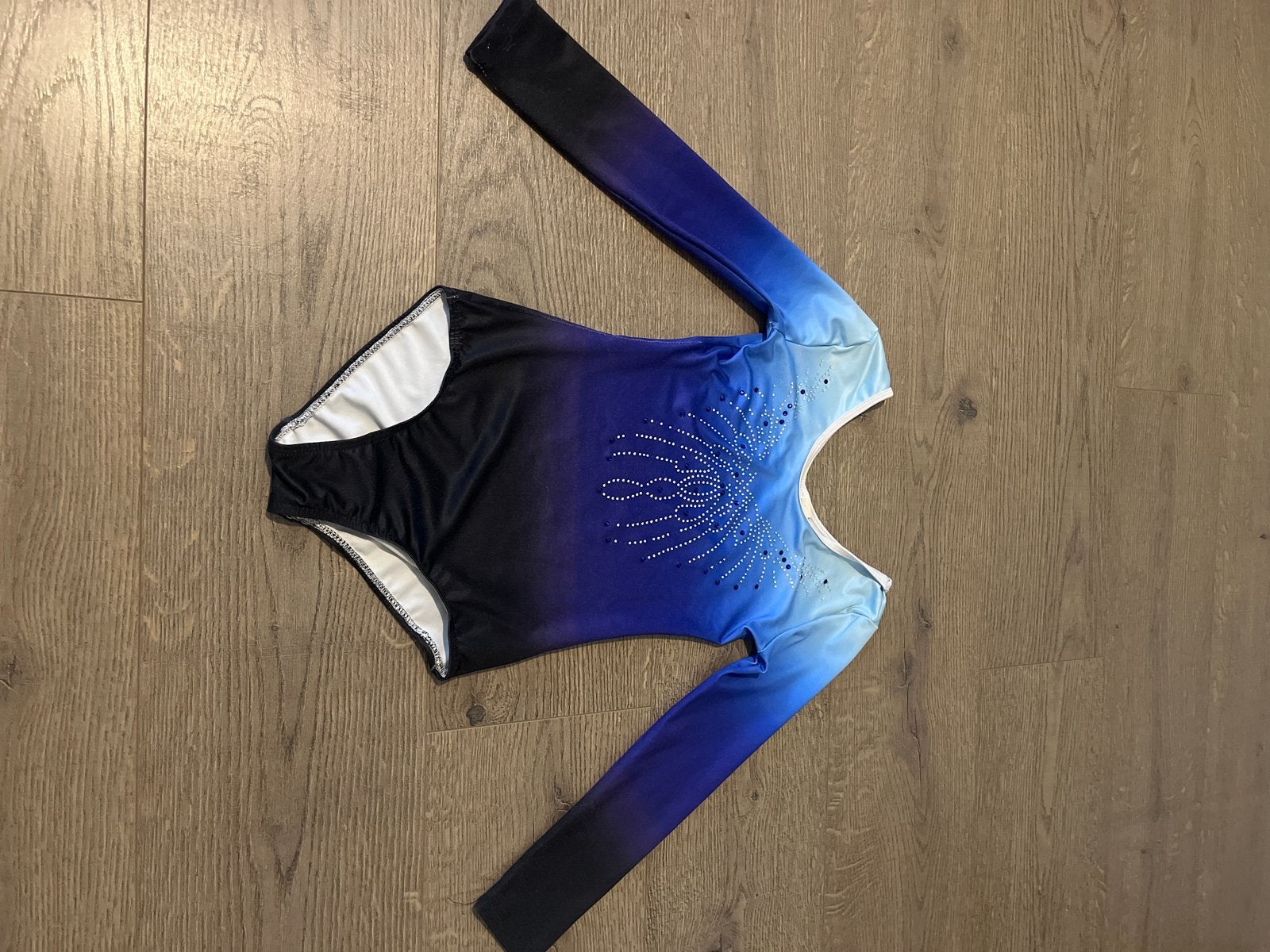 Mooi turnpakje met lange mouwen en glitterdetails, Ophalen of Verzenden, Gebruikt, Blauw, Turnpak(je)