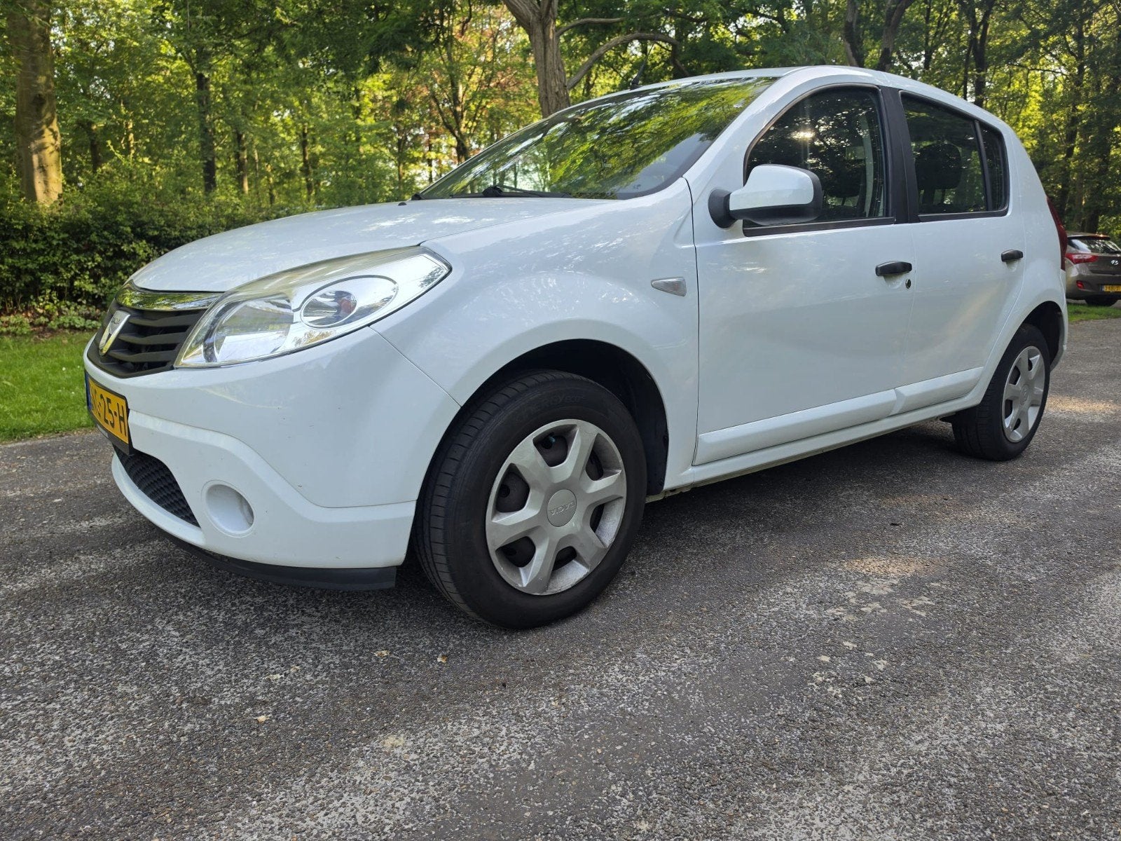 Dacia Sandero 1.2 16V 2010 Wit, Auto's, Dacia, Particulier, Sandero, Benzine, Hatchback, Handgeschakeld, Geïmporteerd, Wit, Stof