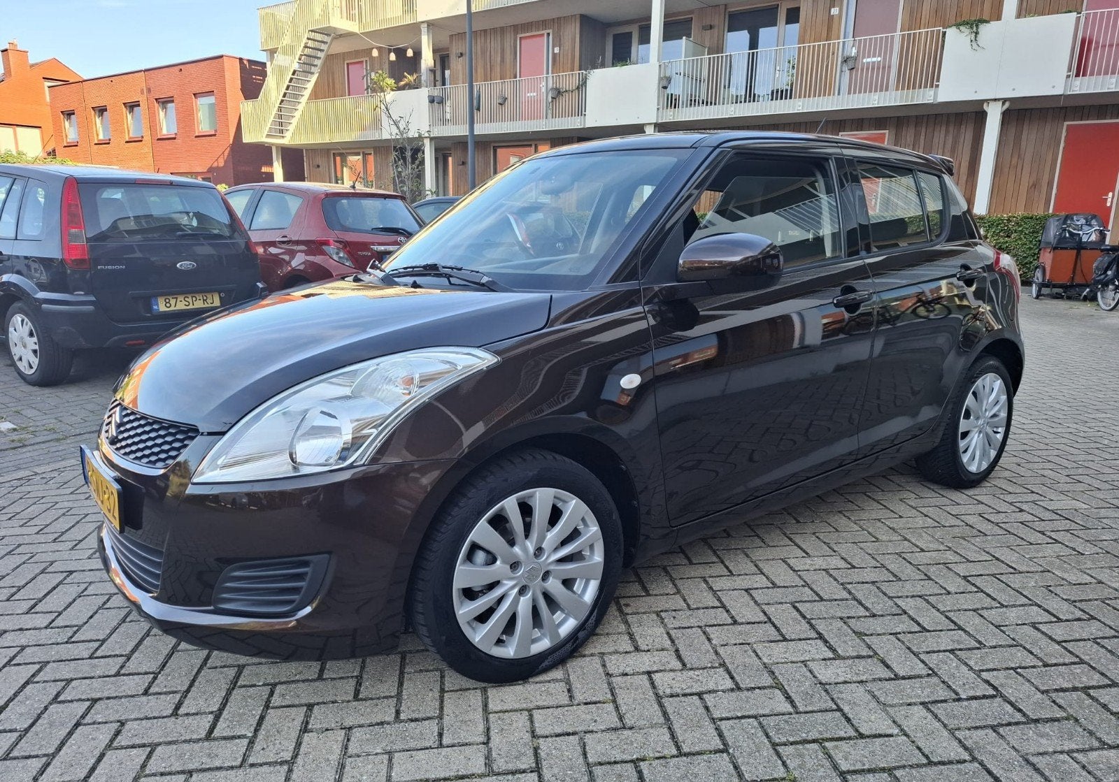 SUZUKI SWIFT 1.2. BANDIT EASSS.AIRCO. CRUISE CONTROL, Auto's, Voorwielaandrijving, Stof, 4 cilinders, Bruin