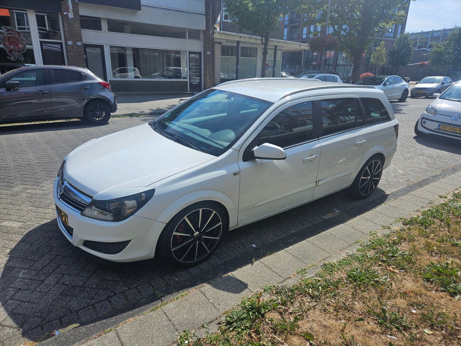 Opel Astra 1.6 16V 85KW St.wgn. 2008 Wit, Auto's, Voorwielaandrijving, 657 kg, 15 km/l, Zwart