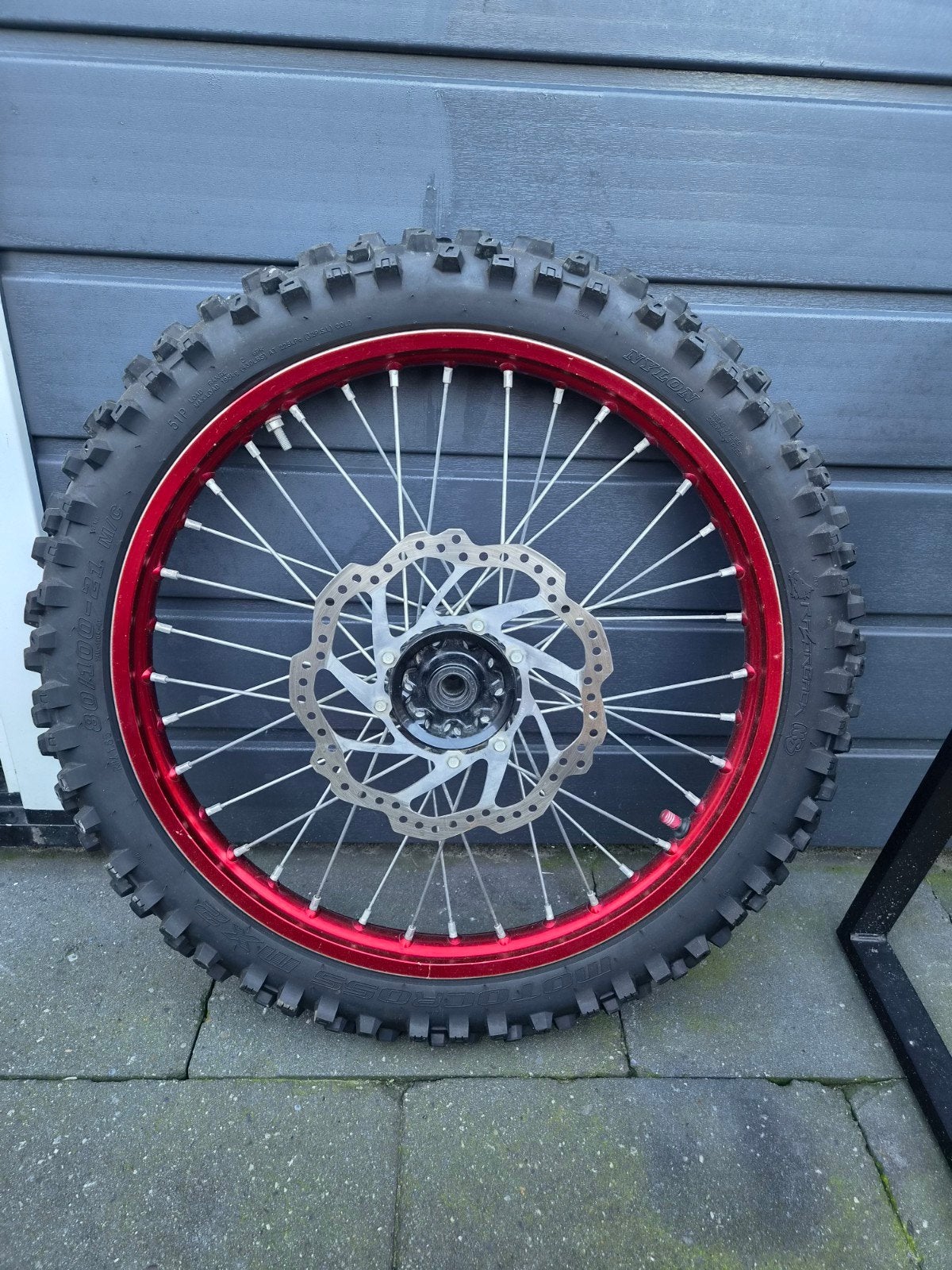 Crossmotor voorwiel 21 inch met band en remschijf, Ophalen, Gebruikt