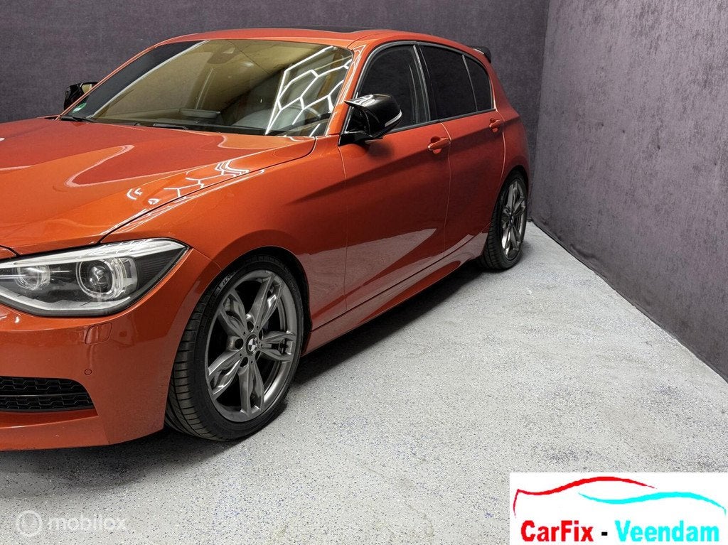 BMW 1-serie M135i xDrive Business+, Auto's, Euro 5, Overige kleuren, 320 pk, Leder