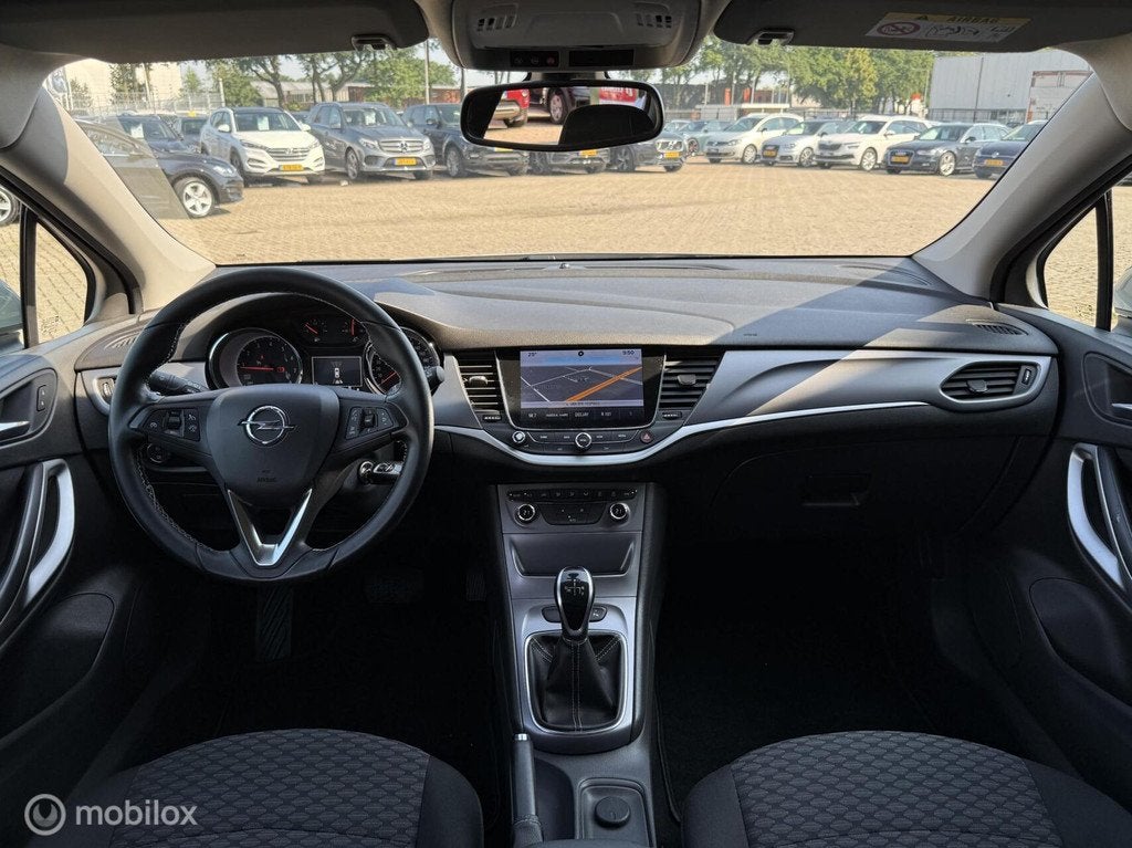 Opel Astra 1.0 Innovation AUTOMAAT | NAVI | PDC | TREKHAAK, Gebruikt, 610 kg, 23 km/l, Bedrijf