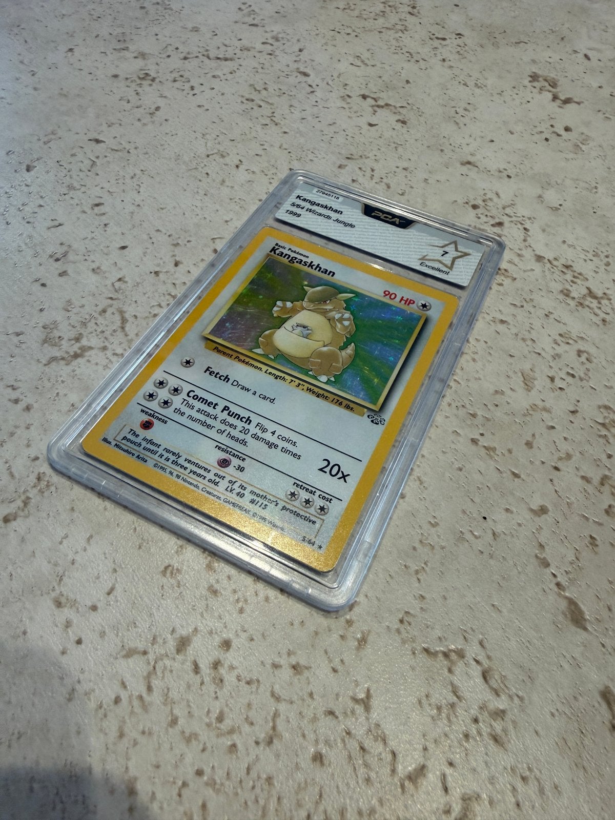 Kangaskhan 5/64 Jungle Base Set 1999 PCA 7 Pokémon Kaart, Hobby en Vrije tijd, Ophalen of Verzenden, Zo goed als nieuw, Losse kaart