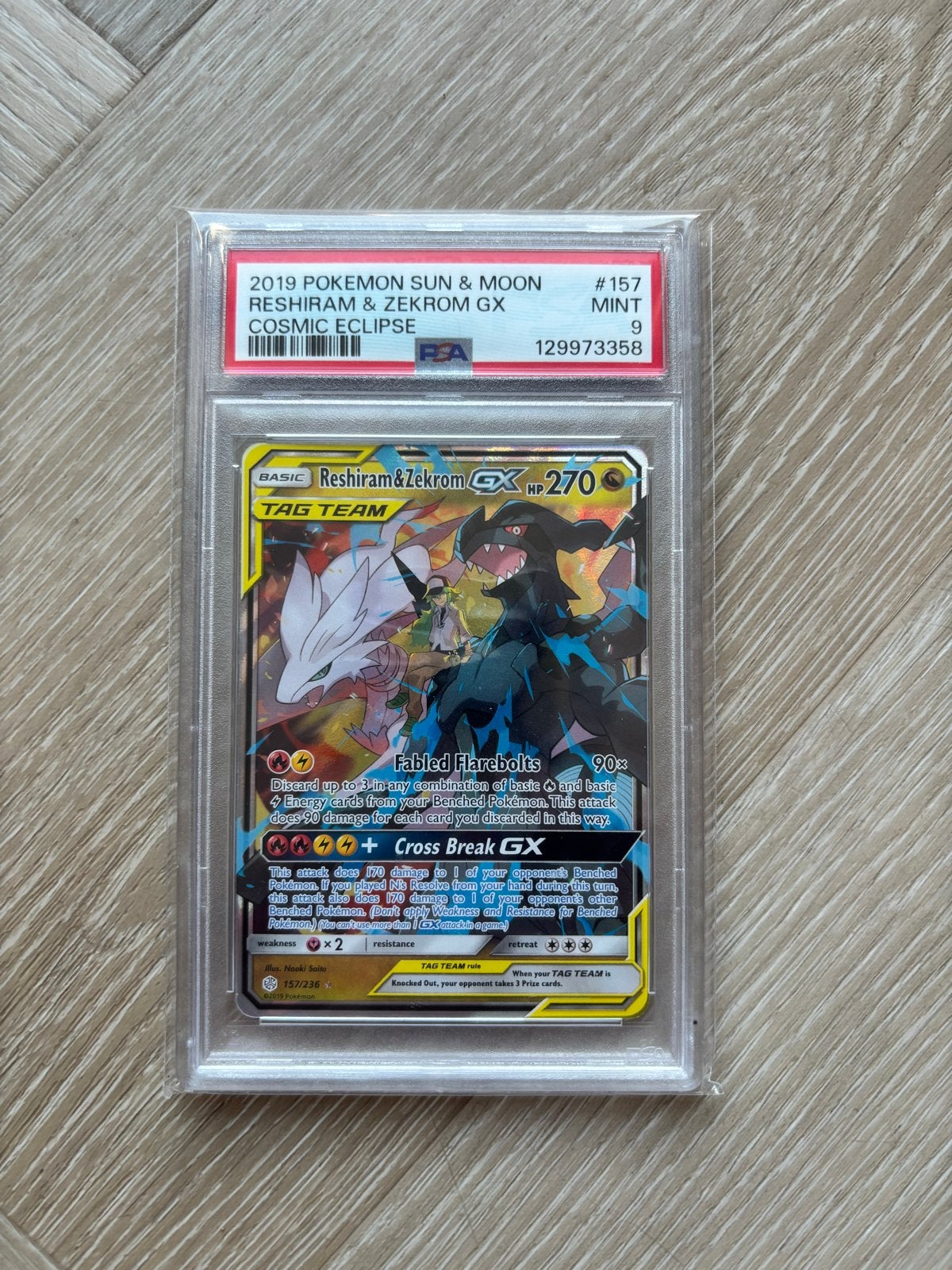 PSA 9 Reshiram & Zekrom GX #157 Cosmic Eclipse, Ophalen of Verzenden, Zo goed als nieuw, Losse kaart