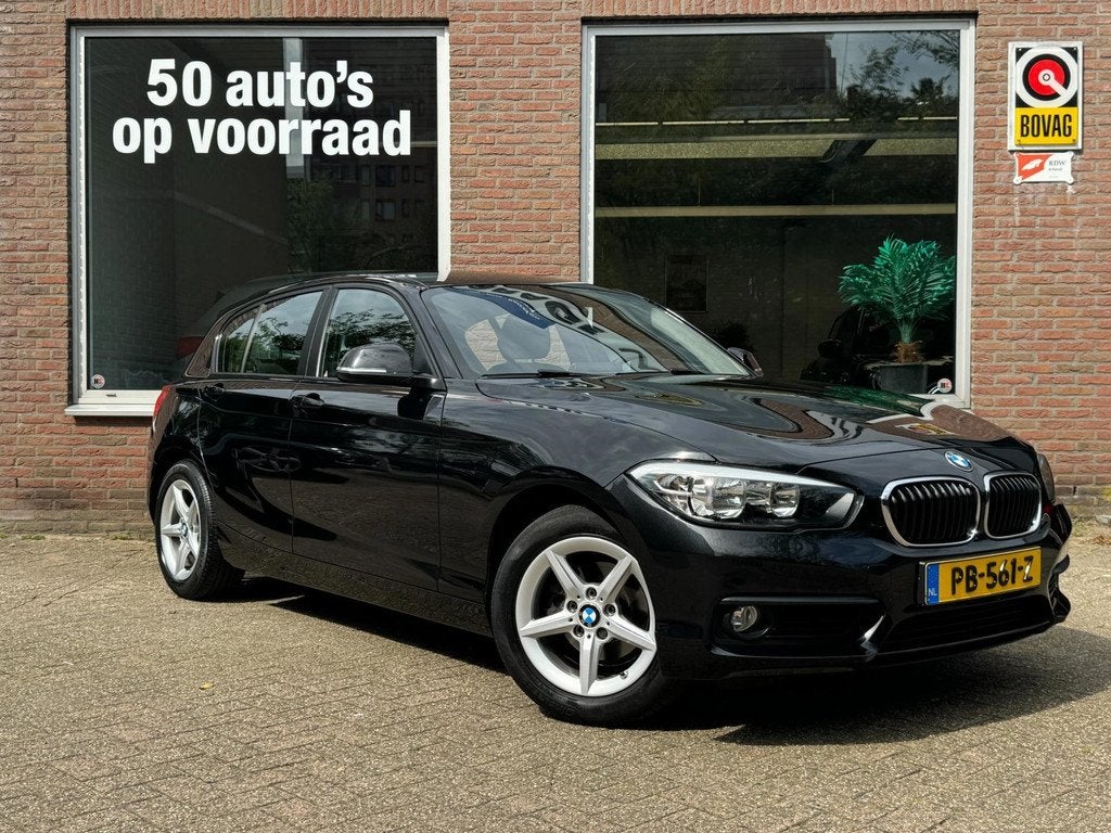 BMW 1-serie 118i Corporate Lease | Navi | Automaat | Cruise, Auto's, BMW, 12 maanden, Gebruikt, Zwart, Bedrijf