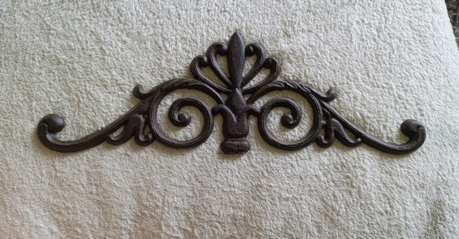 Gietijzer muur ornament, Ophalen