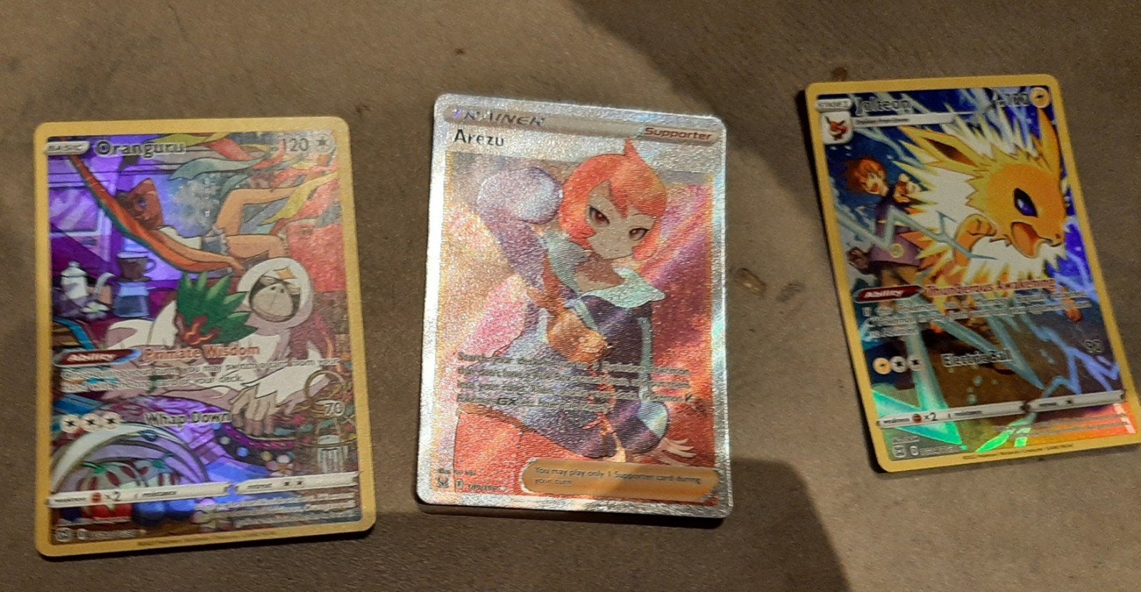 Pokémon Kaarten: Jolteon, Oranguru en  Arezu, Ophalen of Verzenden