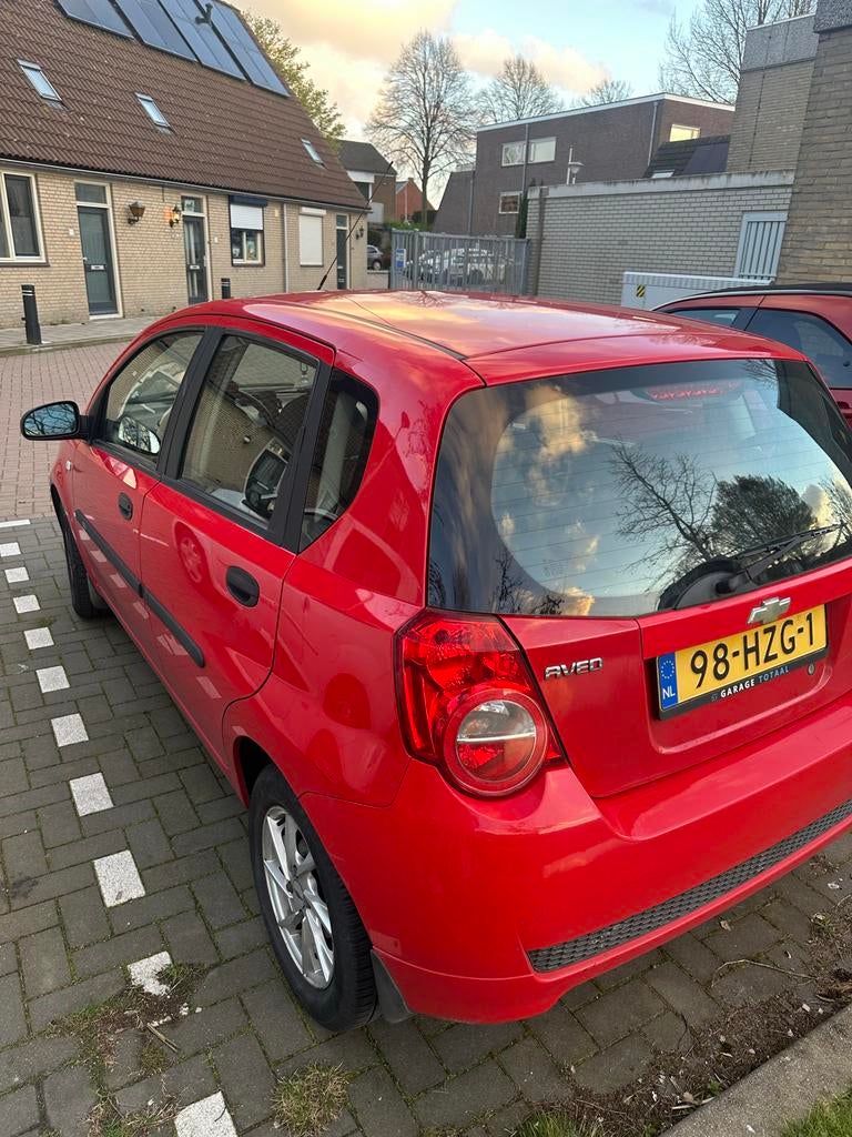 Chevrolet Aveo 1.2 16V 5D 2009 Rood, Auto's, Voorwielaandrijving, 40 €/maand, Aveo, 4 cilinders