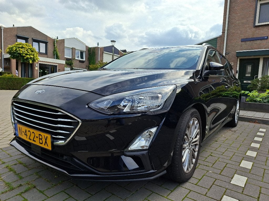 Ford Focus Wagon Tit. X Bns. 2021 Nav. Cam. Dealer ond. NL, Auto's, 1328 kg, 125 pk, Leder en Stof, Zwart