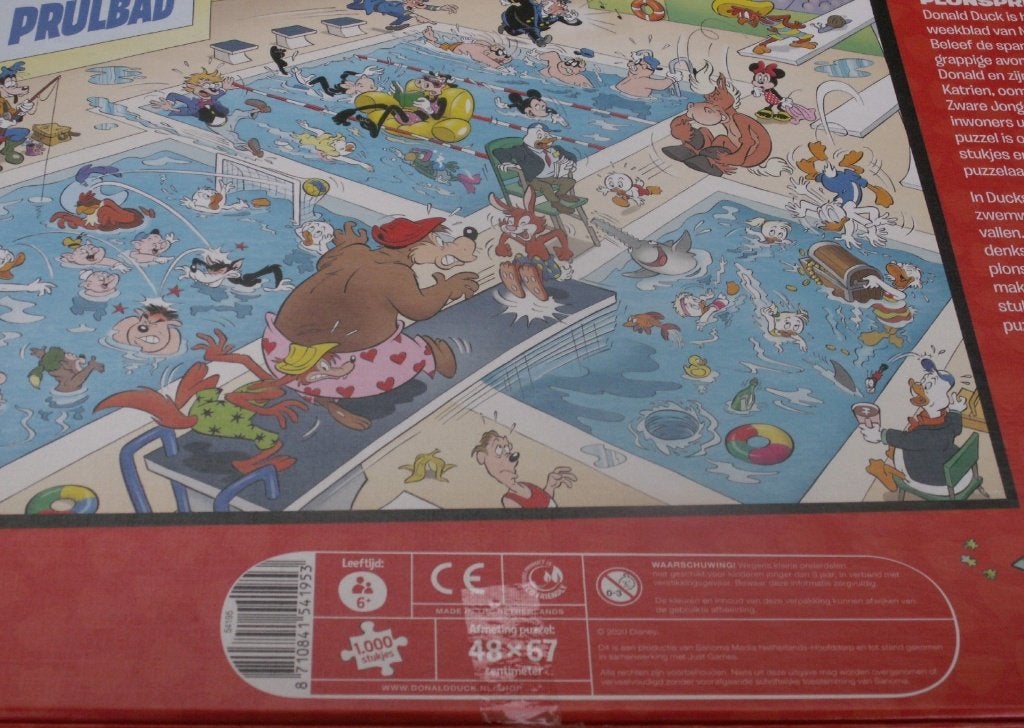 Donald Duck puzzel Plonspret 1000 stukjes incl poster + spel, Ophalen of Verzenden, 500 t/m 1500 stukjes, Zo goed als nieuw