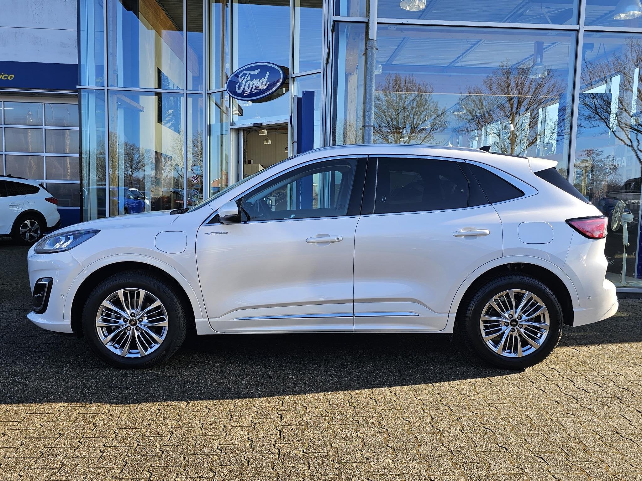 Ford Kuga 2.5 PHEV Vignale Panoramadak | Lederen bekleding |, 14 kWh, Gebruikt, 4 cilinders, Lichtsensor