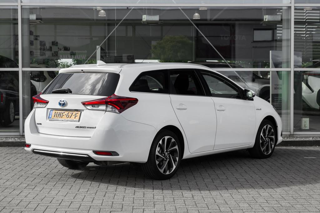 Toyota Auris 1.8 HYBRID TOURING SPORTS CVT, Auto's, Stof, Gebruikt, Euro 6, Wit