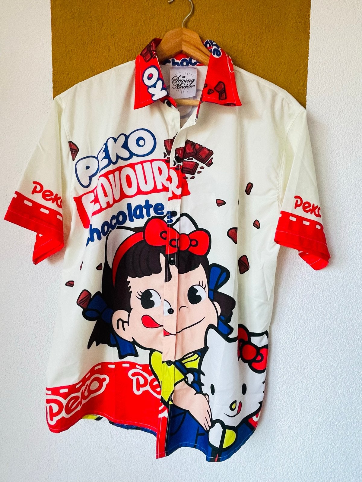 Peko Flavour Chocolate Hello Kitty overhemd Maat L, Kleding | Dames, Blouses en Tunieken, Ophalen of Verzenden, Zo goed als nieuw