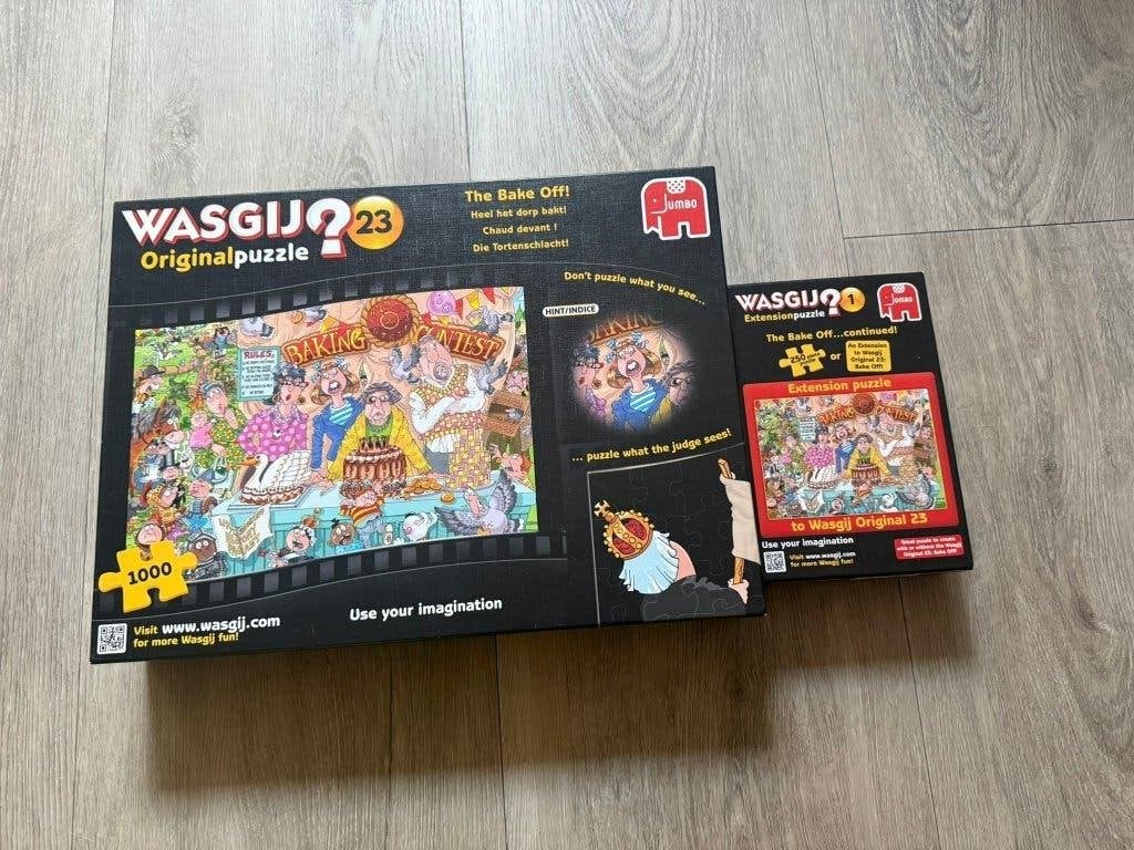 Wasgij 23 met uitbreiding Heel het dorp bakt - Puzzel - 1250, Ophalen of Verzenden, 500 t/m 1500 stukjes, Zo goed als nieuw