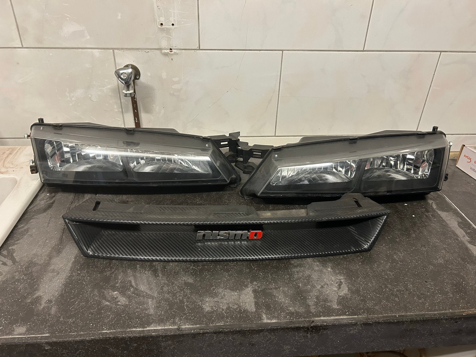 Nissan S14a koplampen + “Nismo” grill, Ophalen of Verzenden, Gebruikt, Nissan