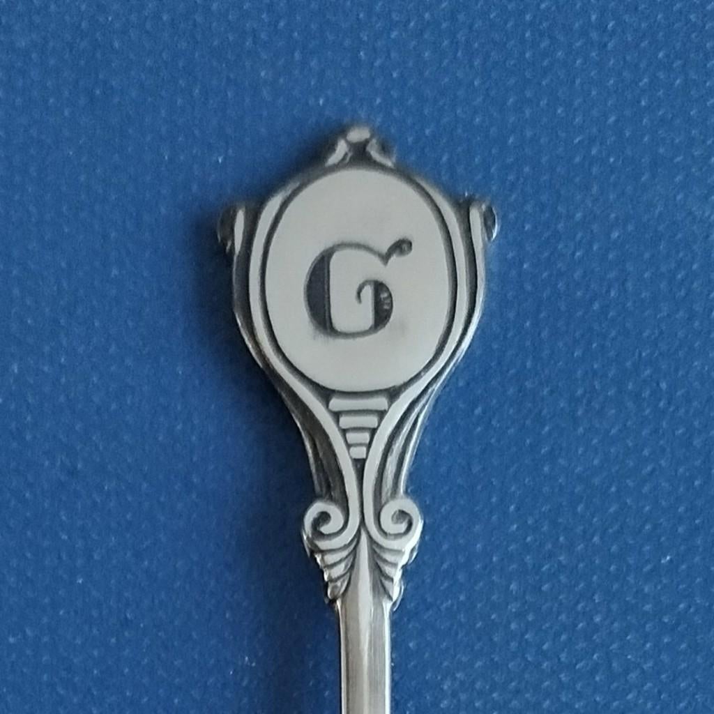 letterlepeltje. lepeltje letter G (Sola Elite), Antiek en Kunst, Antiek | Bestek, Ophalen of Verzenden