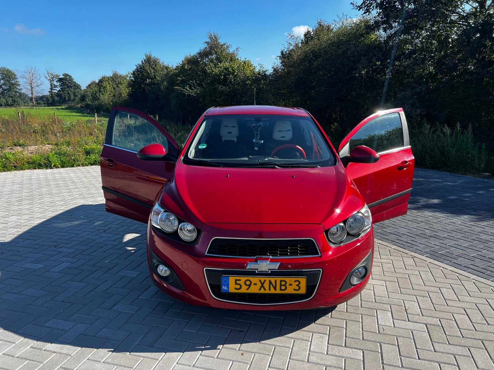 Chevrolet Aveo 1.4 5D 2012 Rood /airco /apk 2027, Auto's, Voorwielaandrijving, 4 cilinders, 100 pk, 49 €/maand